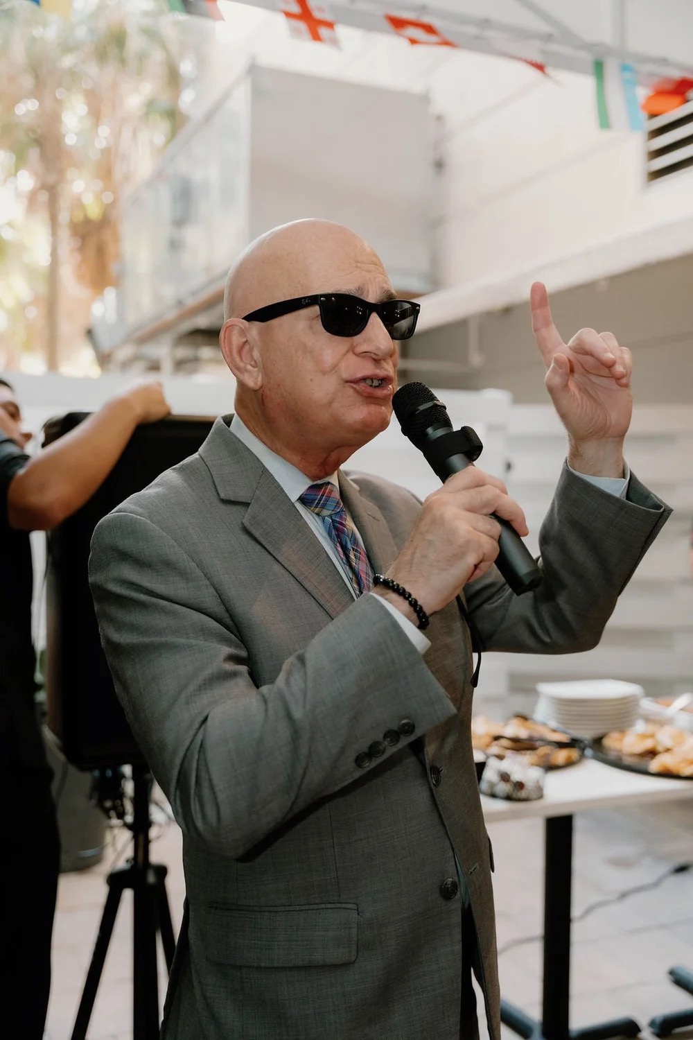 BHA President Ernesto Cuesta speaking into a microphone